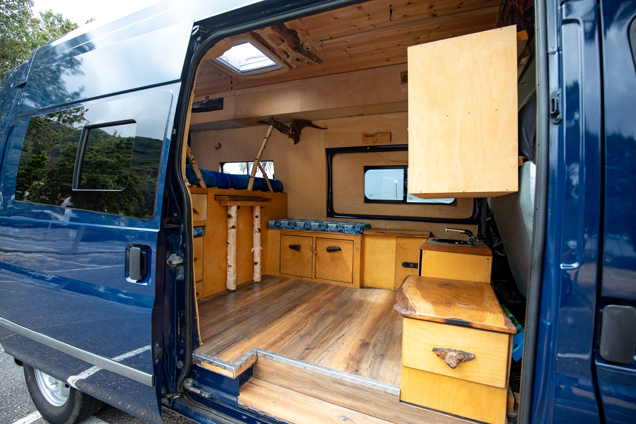 Sleeping area inside campervan Madeira – bed with linen included
