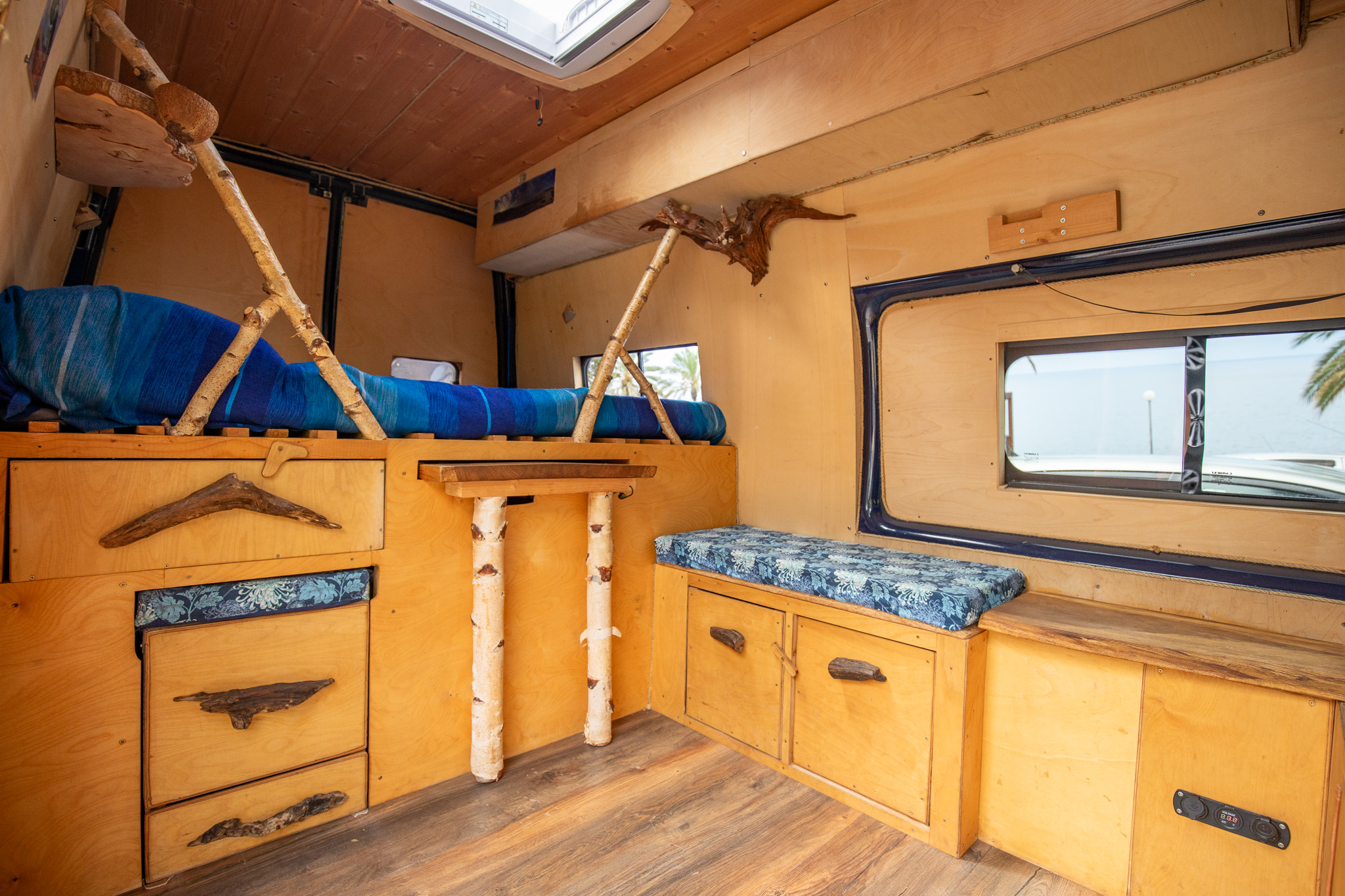 Seating area with table – campervan Madeira self-guided tour